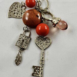 Gold plated necklace, charm style, keys, orange acrylic beads, signed VCLM 1990s